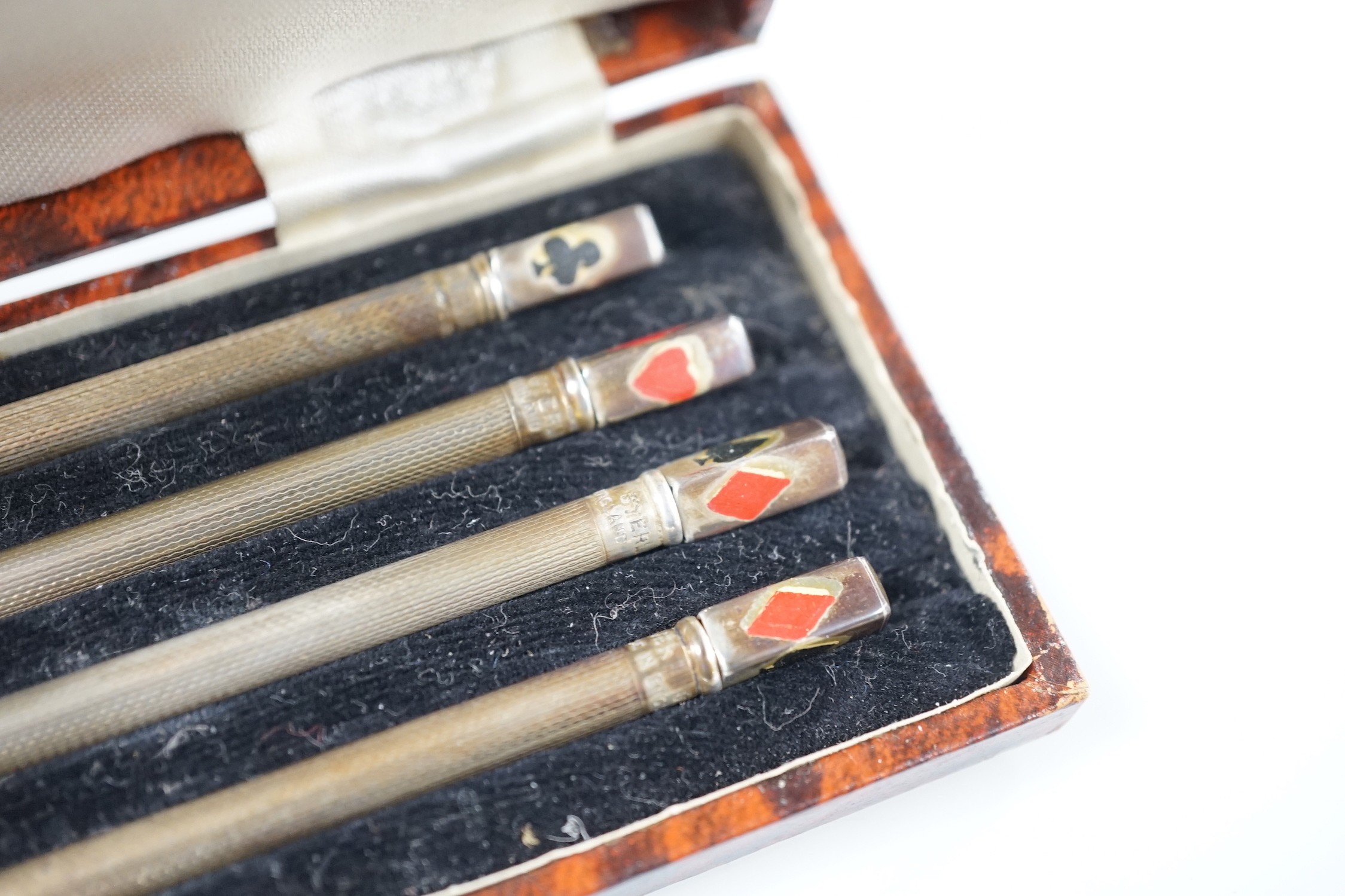 An engine-turned silver fountain pen, a cased set of four silver Bridge pencils and a silver combination pencil/rule